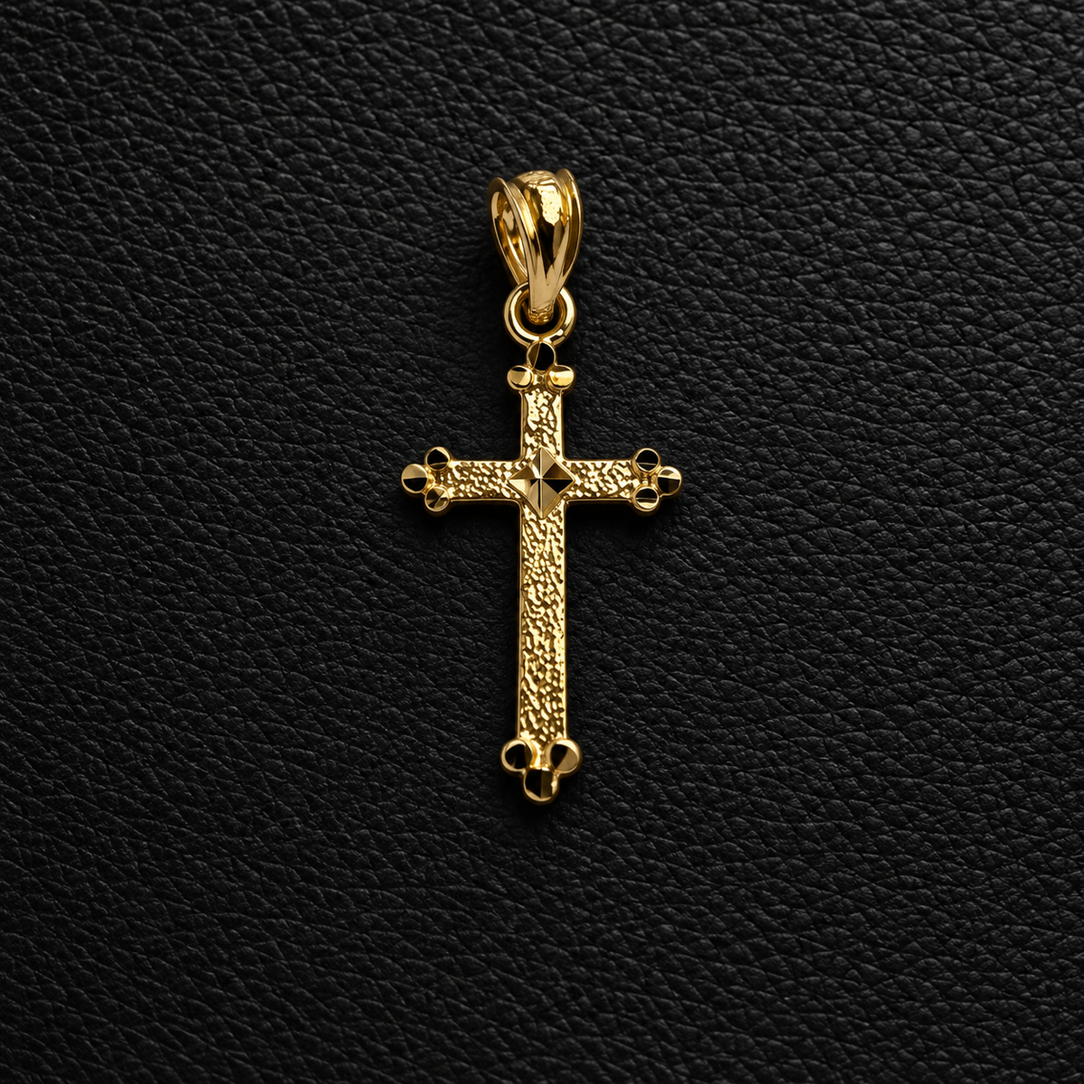 10K yellow gold textured cross pendant on black leather