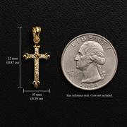 10K yellow gold cross pendant shown beside a U.S. quarter with dimensions